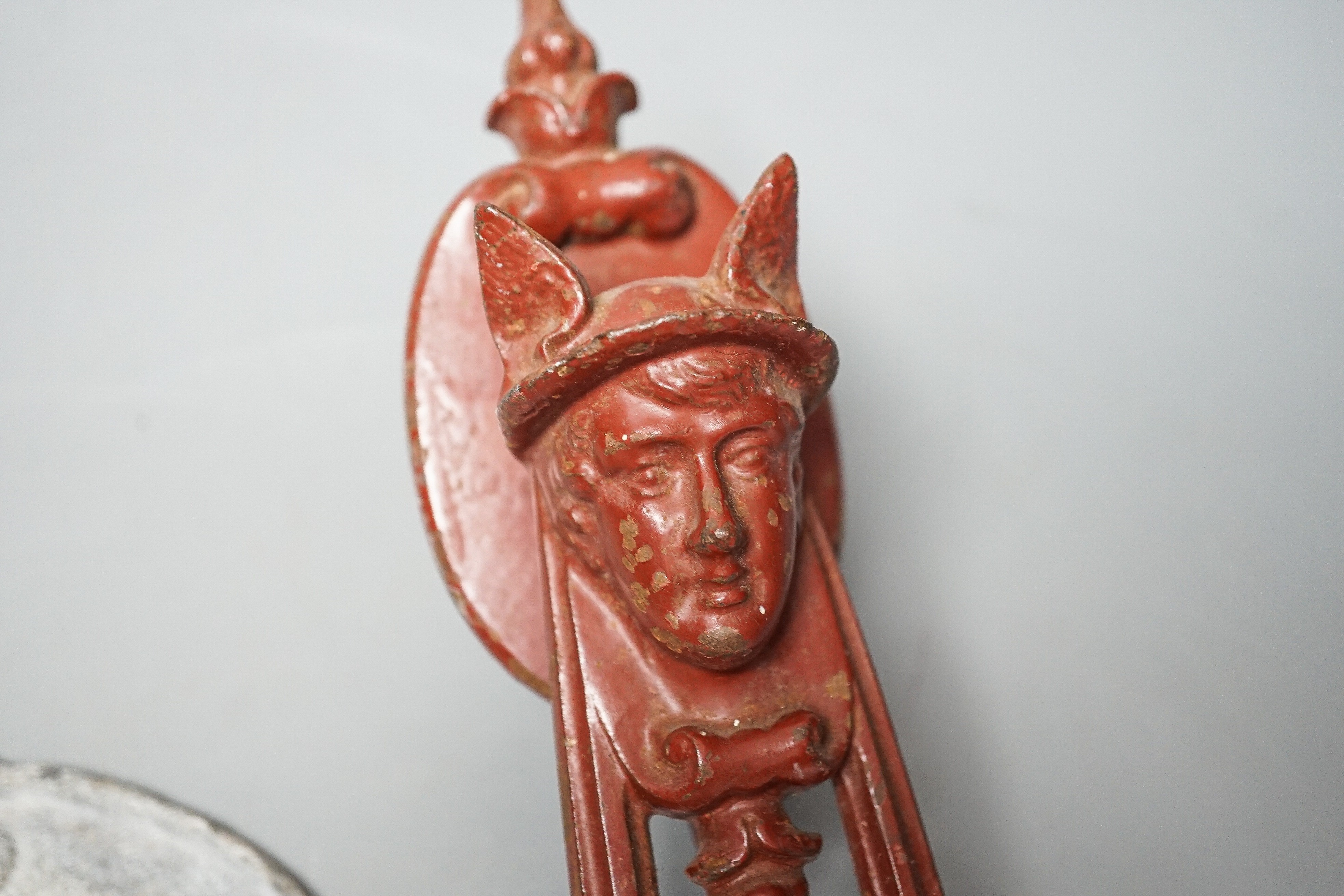 A Manchester lead plaque, 24cm high and a ‘Hermes’ cast iron door knocker